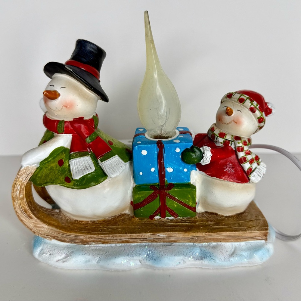 Festive Snowman Candle lamp‎ winter sledding fun